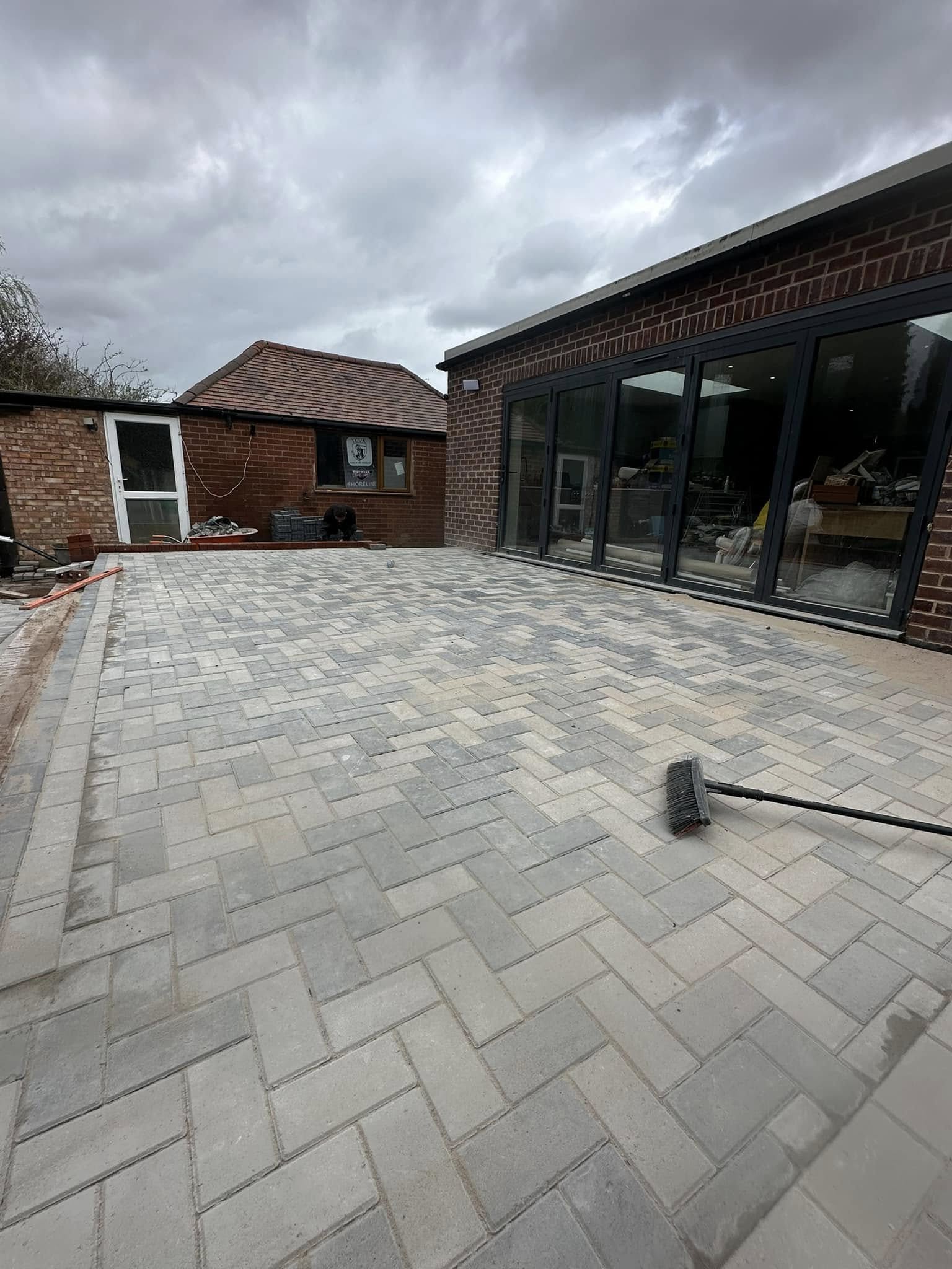 Re-coloured patio paving installation